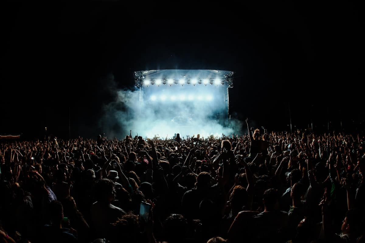 Stage lights over a concert crowd at a live venue