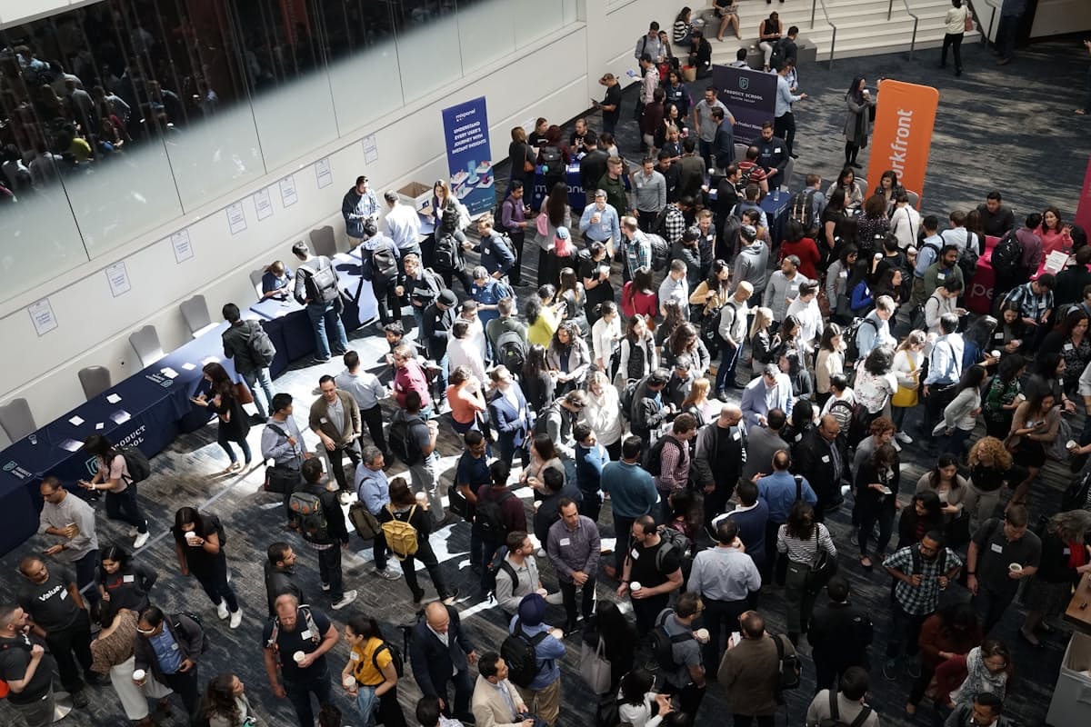 Busy conference lobby crowd between sessions