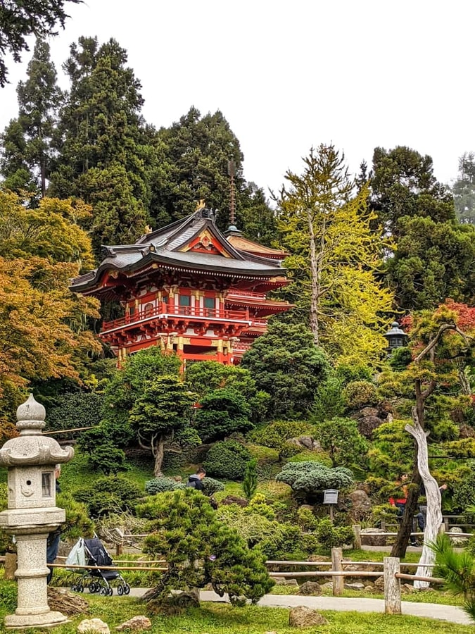 Historic red building among trees in Golden Gate Park, San Francisco