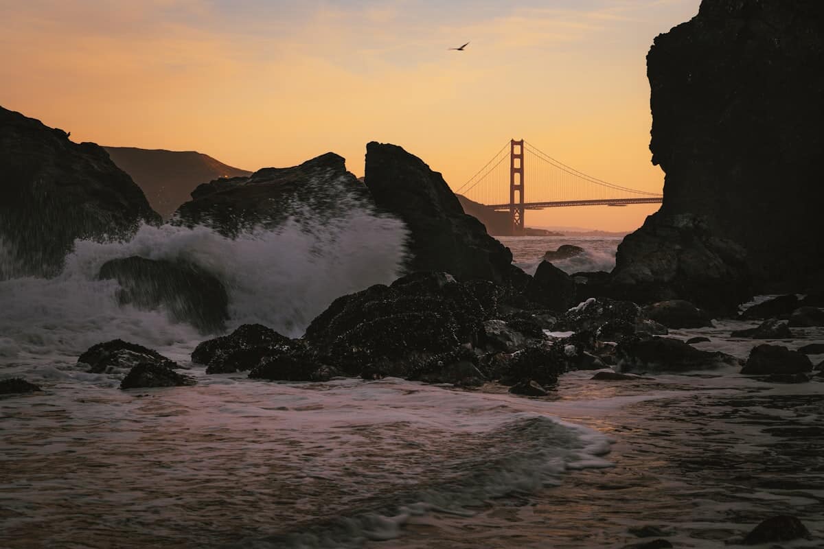 Coastal cliffs at Lands End with the Golden Gate Bridge beyond