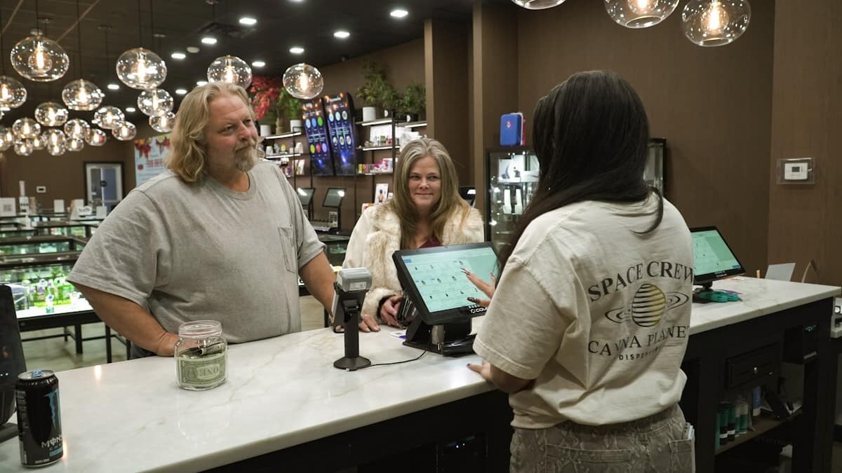 Customers talking with staff at a San Francisco dispensary counter
